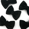 Velvet black bow tie for a dog an elegant ornament for special occasions, attached to the collar