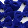 Velvet dark blue bow tie for a dog an elegant ornament for special occasions, attached to the collar