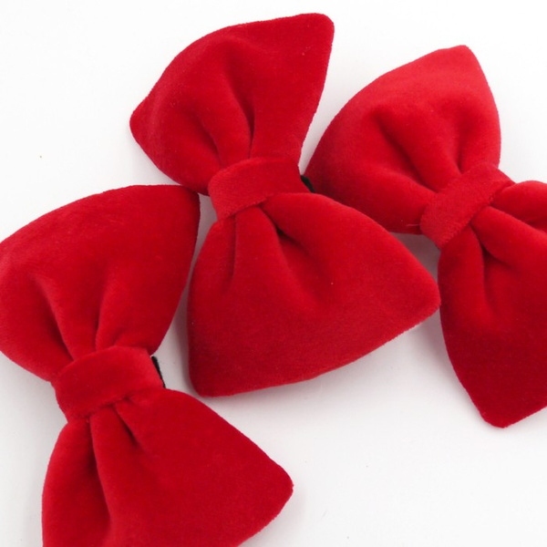 Velvet red bow tie for a dog an elegant ornament for special occasions, attached to the collar