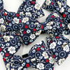 Navy Bow Tie Bow for a dog with flowers, attached to the collar