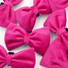 Velvet pink bow tie for a dog an elegant ornament for special occasions, attached to the collar